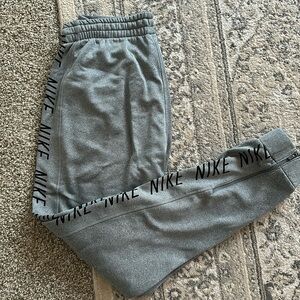Medium Nike grey joggers with zippers on the bottom